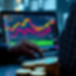 A person looking at Bitcoin charts on a laptop screen with coins in the foreground.